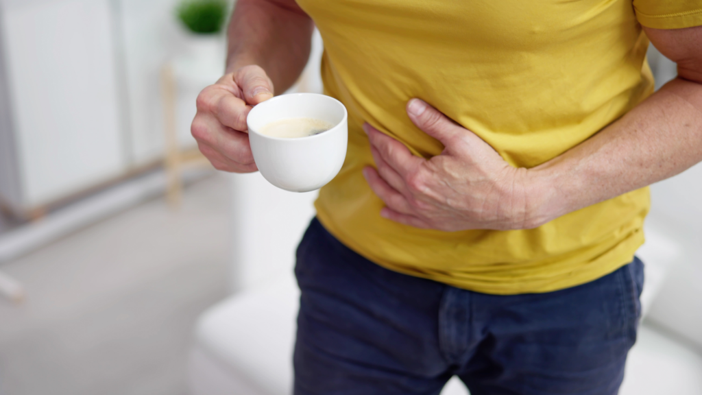 man having acid reflux from coffee